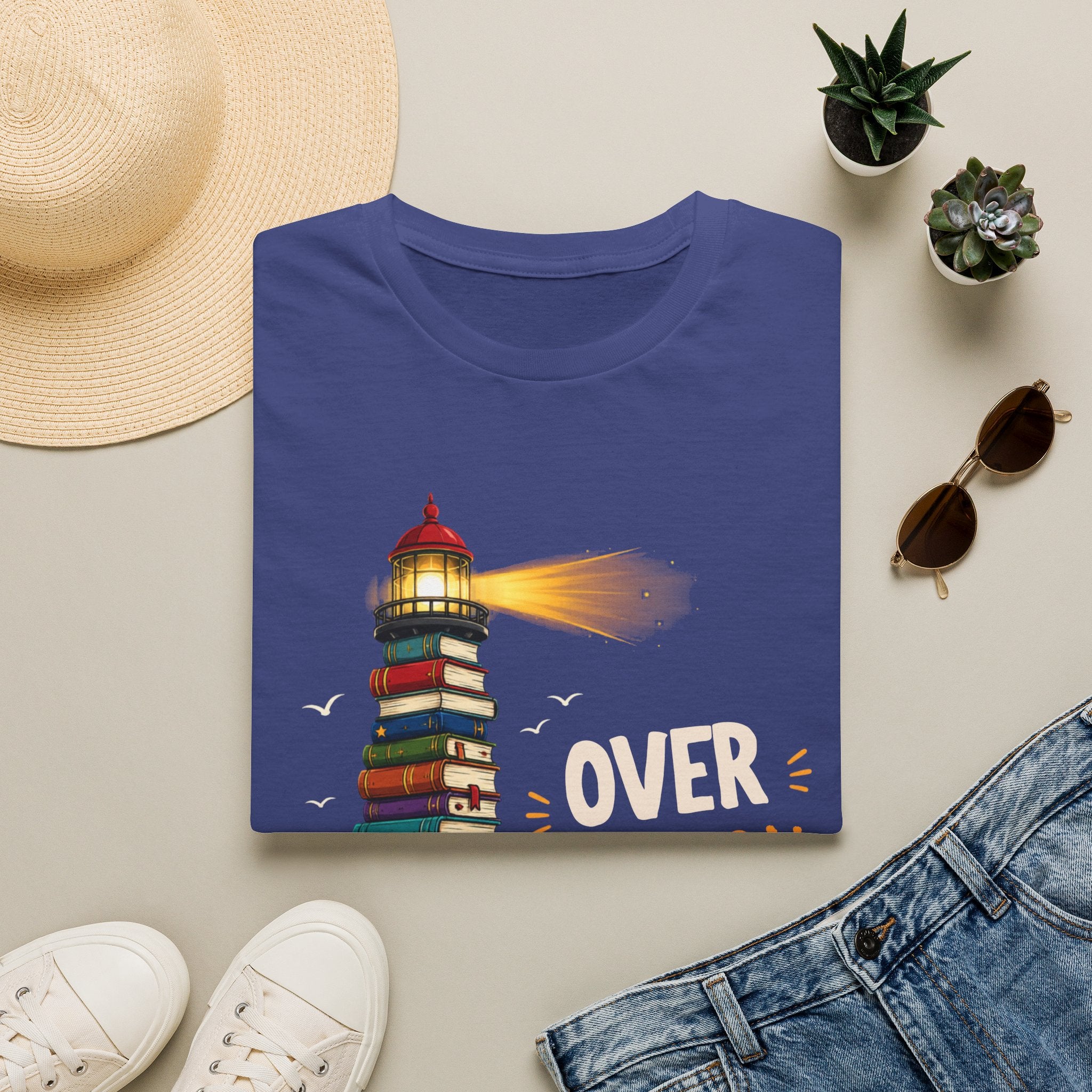 'Over the Horizon' Lighthouse Stack of Books Graphic Tee – Reading Lights the Way